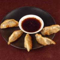 GYOZA  (3PD) · Pan-seared Japanese pot-sticker dumplings filled with shredded pork and vegetables. Served w...