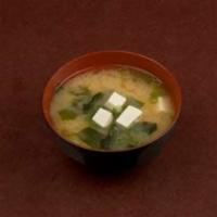 MISO SHIRU · The traditional miso soup with tofu cubes, wakame seaweed, and green onions.