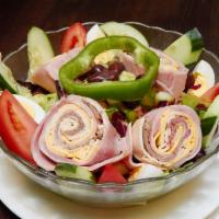 Chef Salad · Turkey, ham, roast beef, Swiss cheese, American cheese, tomatoes and salad greens. 