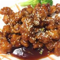 Sesame Chicken · Breaded fried white meat stir-fried in sweet brown sauce with sesame seeds.