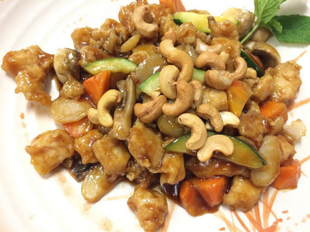 Chicken with Cashew Nuts · Diced chicken stir-fried with carrots, mushroom, zucchini and roasted cashews in our house special brown sauce.
