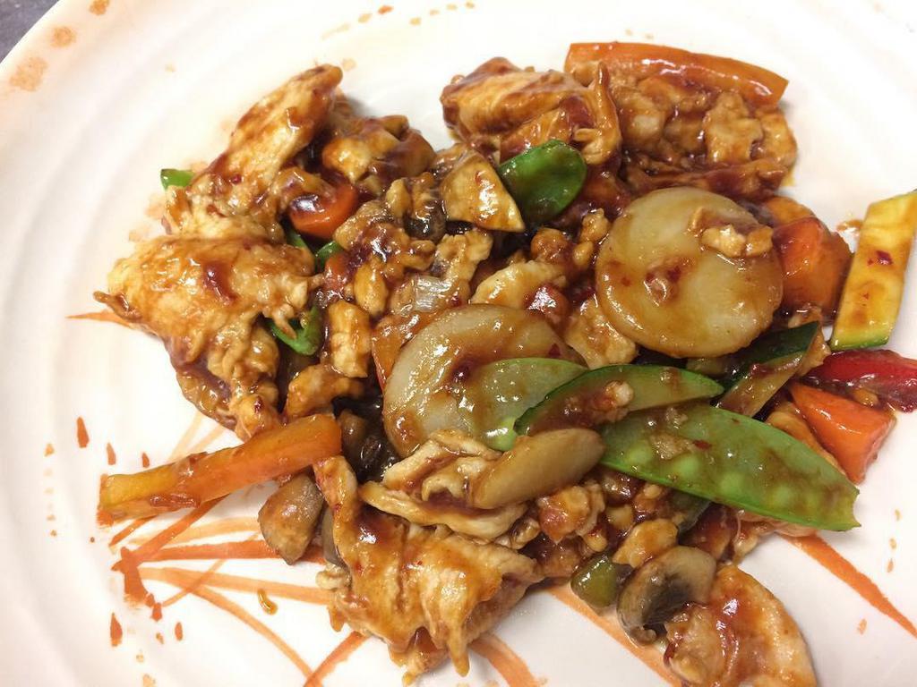 Chicken in Garlic Sauce · Sliced white meat chicken stir-fried with zucchini, carrots, bell peppers, snow peas and mushrooms in mild-spicy garlic sauce.