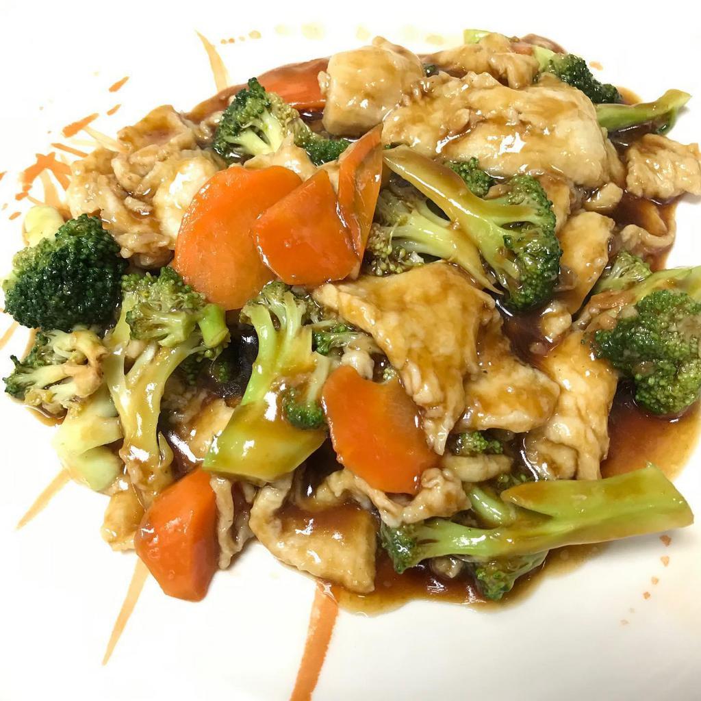Chicken with Broccoli · Sliced white meat chicken stir-fried in house special brown sauce with steamed fresh broccoli, and carrots.