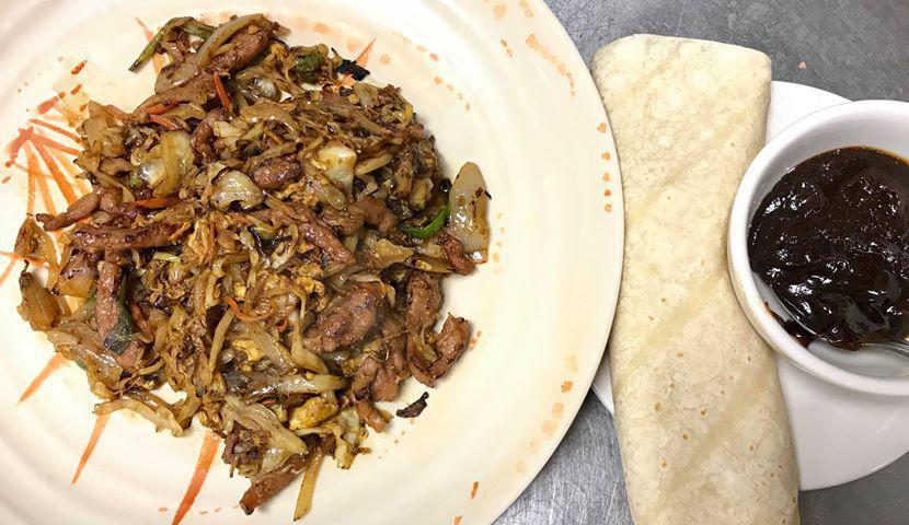 Moo Shu Pork · Shredded pork meat cooked with vegetables and cabbages, seasoned with minced ginger, garlic and scallions. Served with warm pancakes and Hoisin sauce.