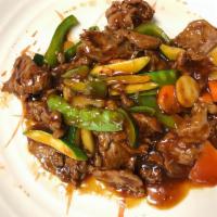 Beef in Garlic Sauce · Slices of tender beef stir-fried with carrots, zucchini, snow peas, mushrooms and bell peppe...