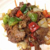 Pepper Steak · Thin sliced beef with bell peppers and onions stir-fried in garlic brown sauce.