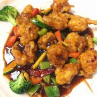 General Tso's Shrimp · ​Battered and deep-fried shrimp stir-fried with diced bell peppers in sweet and spicy sauce.