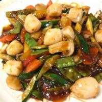 Scallops in Garlic Sauce · Scallops with carrots, zucchini, snow peas, bell peppers, and mushrooms stir-fried in mild-s...