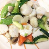 Scallops Delight · Fresh sea scallops with assorted veggies stir-fried in a savory seafood sauce.