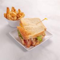 Original Roadhouse Club Sandwich · Roasted turkey breast sliced thinly and piled high. Topped with crispy bacon, mild cheddar c...