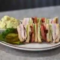 Clubhouse Sandwich · Triple decker on grilled sourdough bread with melted American cheese, slices of fresh tomato...