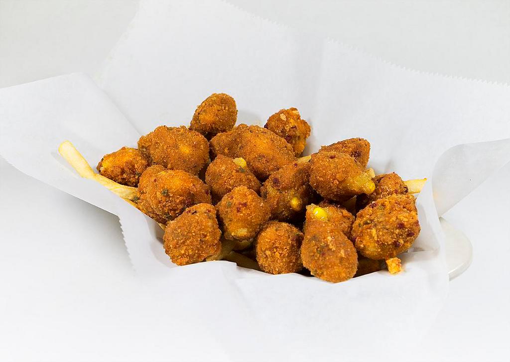Great Balls of Fire · Deep Fried Creamed Corn Hushpuppies, seasoned with Jalapeno Peppers and Cheddar Cheese Sauce