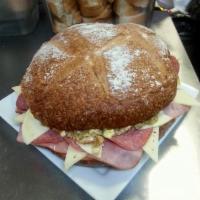 Central Grocery Muffaletta · Smoked Ham, Genoa Salami, Provolone Cheese, and Swiss Cheese topped with Chef BB's own Olive...