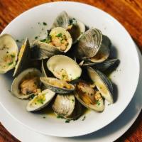 Steamed Clams · Little neck clams steamed in a white garlic sauce.