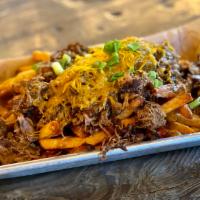 Debris Fries  · Braised and shredded beef and brown gravy topped with cheddar cheese & green onions.   ***Fr...