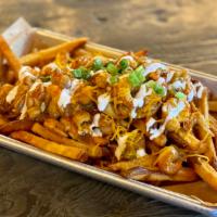 Big Easy Fries · Cheddar cheese fries topped with crawfish and shrimp etoufee, sour cream, and scallions.  **...