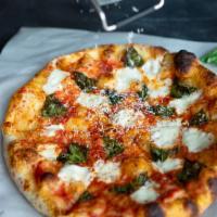 Margherita Napoli Pizza · Traditional marinara, fresh mozzarella, basil, olive oil, and Parmigiano Reggiano.