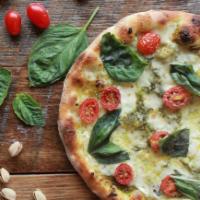 Pistachio Pesto Pizza · Housemade pistachio pesto sauce, five cheeses, grape tomatoes, and basil