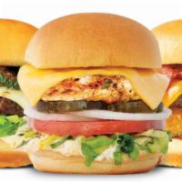 Trio Burger · Three 3 oz. burgers. Includes Roma tomato, leaf lettuce, shaved onions, pickles, American ch...