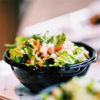 House Salad · Romaine lettuce, diced tomatoes, cucumbers, onions and tossed with balsamic.