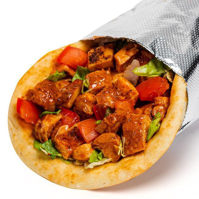Signature Spicy Chicken Sandwich · Our fan-favorite pita bread stuffed with tender, sous-vide cooked chicken marinated in a blend of our fiery hot sauce and tangy BBQ sauce along with your favorite ingredients