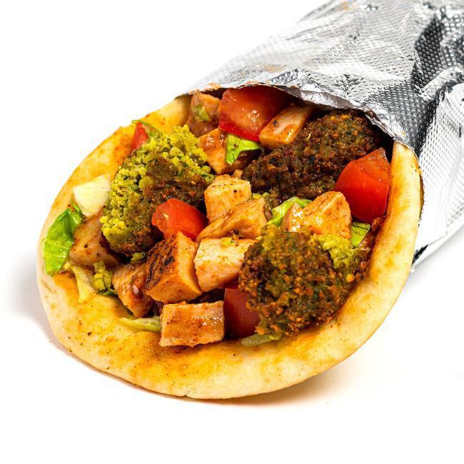 Signature Spicy Chicken/Falafel Sandwich · Our fan-favorite pita bread stuffed with tender, sous-vide cooked chicken marinated in a blend of our fiery hot sauce and tangy BBQ sauce and our delicious falafel, along with your favorite ingredients