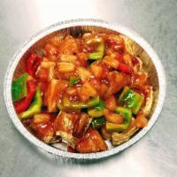 Sweet and Sour Soy Protein · Soy protein in sweet and sour sauce with green and red bell pepper and pineapple.