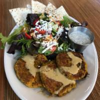 Falafel Salad · Grilled falafel patties drizzled with lemon tahini, served on top of organic mixed greens wi...