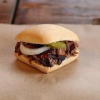 Slider · Choice of a slow-smoked meat on a yeast roll