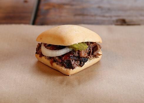 Slider · Choice of a slow-smoked meat on a yeast roll
