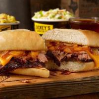 Pit Dip Sandwich Plate. · Sliced brisket, pit-smoked caramelized onions, & cheddar cheese on a toasted hoagie bun. Ser...