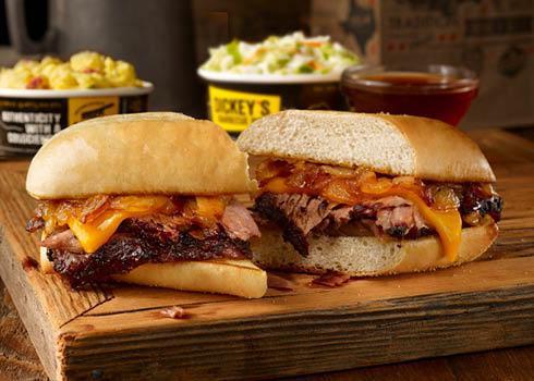 Pit Dip Sandwich Plate · Sliced brisket, pit-smoked caramelized onions, & cheddar cheese on a toasted hoagie bun. Served with smoky beef dipping sauce and 2 sides.