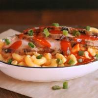 Buffalo Chicken Mac Stack · Spicy Buffalo Chicken with creamy Mac and Cheese topped with green onions