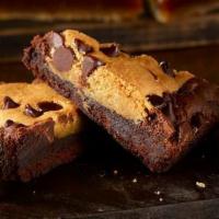 Blondie Brownie · Roasted pecans, semi-sweet chocolate chips blended into a buttery, cookie-style brownie