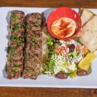 Lamb Kabob · 2 skewers of seasoned ground Lamb mixed with onions, herbs and spices, charbroiled and cooke...