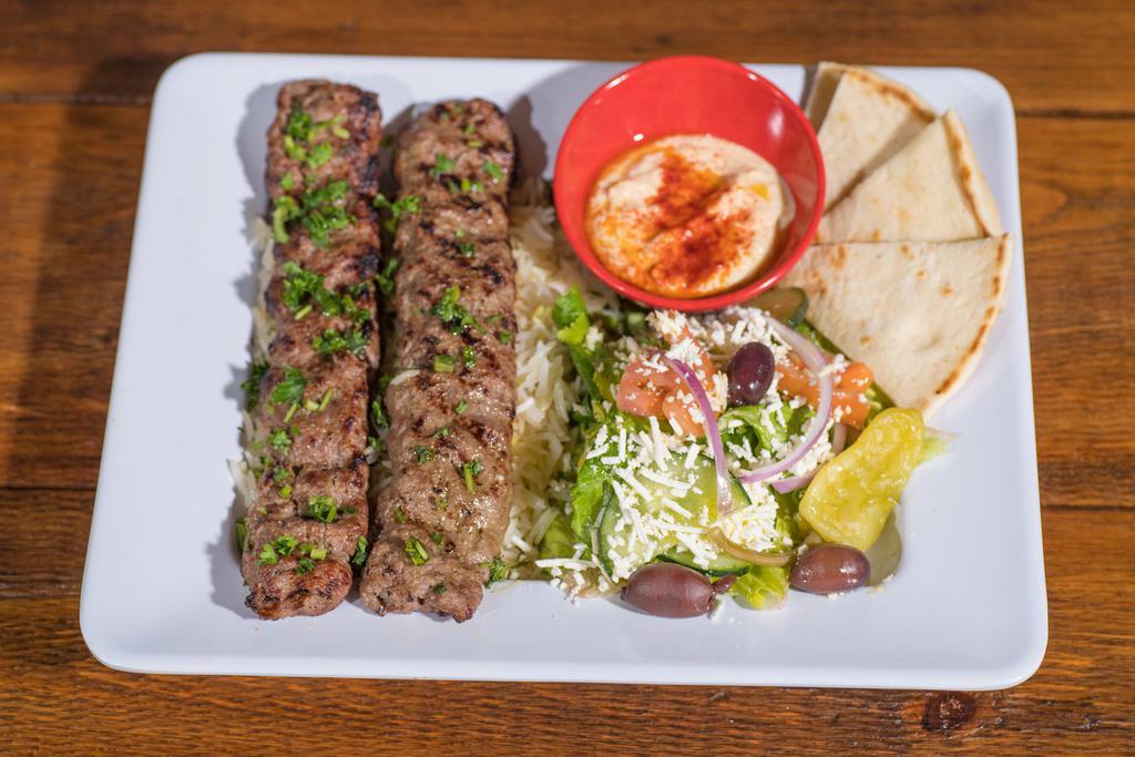 Lamb Kabob · 2 skewers of seasoned ground Lamb mixed with onions, herbs and spices, charbroiled and cooked on a fire flamed grill, served with hummus.