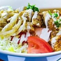 8. Shawarma Bowl · Tri-tip or chicken shawarma, rice, lettuce, tomatoes, sauteed onions, sliced olives crispy p...