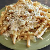 Greek Fries · Fries topped with feta cheese, seasoning, and our signature yellow sauce.