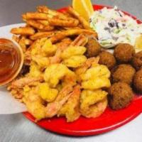 Shrimp Plate · 12 Peeled and deveined large shrimp tails on.  Served with seasoned fries, Cole slaw, 4 hush...