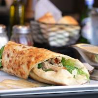 Chicken Caesar Pizza Wrap · Grilled chicken, romaine lettuce, Parmesan cheese, and Caesar dressing.