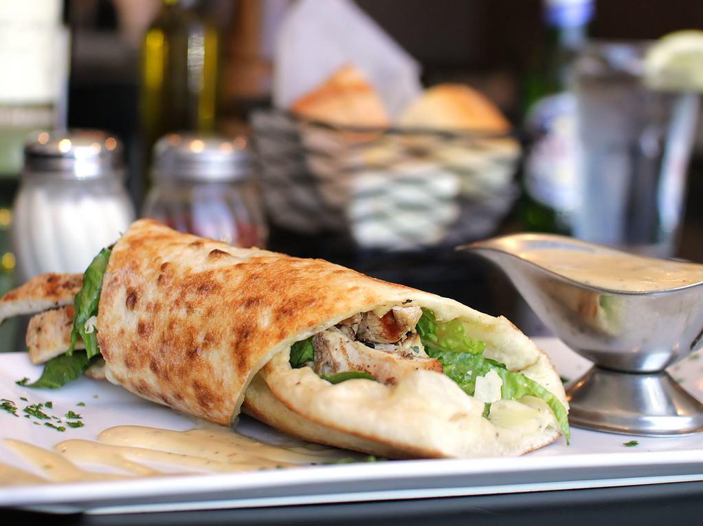 Chicken Caesar Pizza Wrap · Grilled chicken, romaine lettuce, Parmesan cheese, and Caesar dressing.