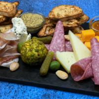 Charcuterie Board · Contains Nuts. Artisanal cheeses, selected meats, accouterments.
