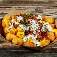 Supreme Tots  · Tater Tots topped with cheese, bacon, chives, and b's ranch. 