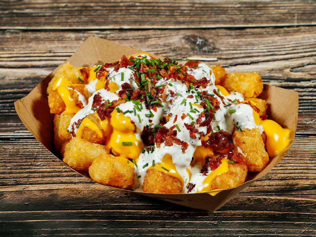 Supreme Tots  · Tater Tots topped with cheese, bacon, chives, and b's ranch. 