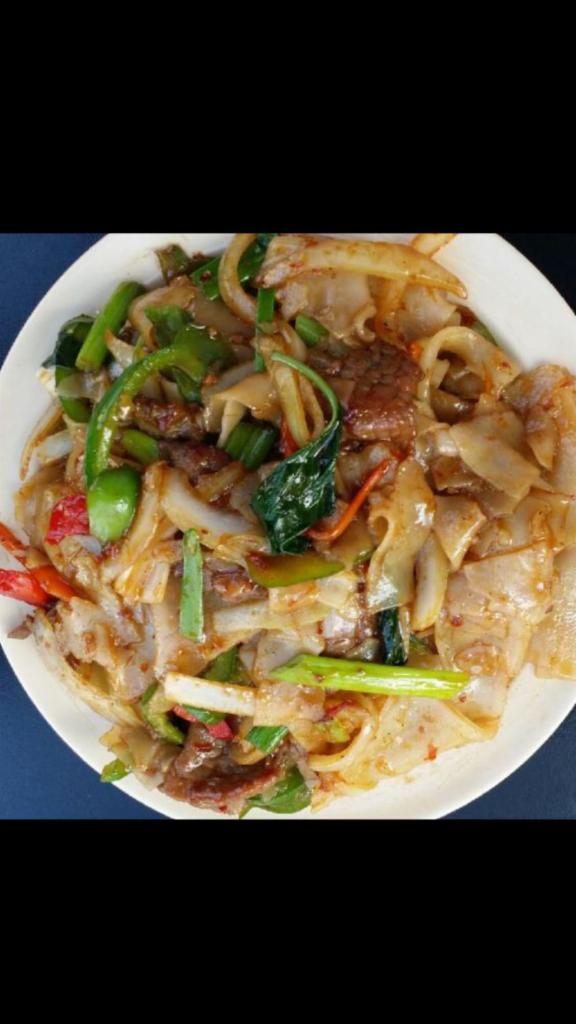 T6. Pad Ki Mao · Thailand style stir-fried broad rice noodles with chicken, peppers, onion, and chili paste in spicy Thai basil sauce. Spicy.