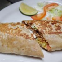 Burrito California · 1 extra large flour tortilla filled with fajita or chicken,
rice, beans, lettuce, tomato, so...