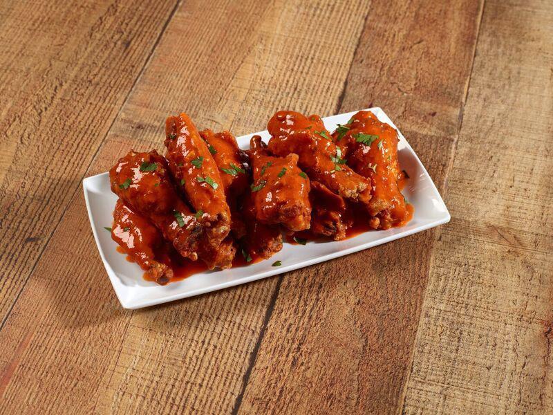 10 Wings · 10 Traditional or Boneless Wings, 1 Sauce Choice ONLY with 1 ranch or 1 blue cheese. Sauce splits not offered.