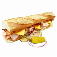 27. Turkey Club With Bacon Baguette Sandwich · Served on a 10
