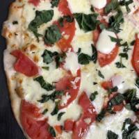 Gluten-Free Margherita Pie · mozzarella, garlic, fresh sliced tomatoes, fresh mozzarella, basil, extra virgin olive oil