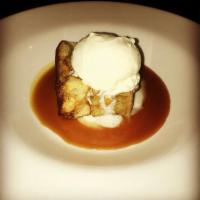 Redneck Bread Pudding · Bourbon bread pudding with homemade salted caramel sauce, served with vanilla ice cream.